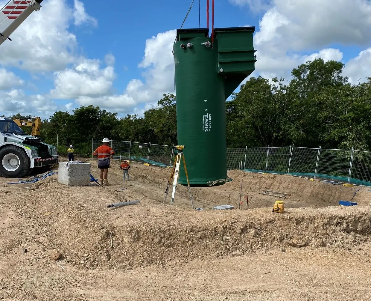 Mullaly FRP pump station with integrated valve chamber being lowered by crane into the excavation at The Orchard