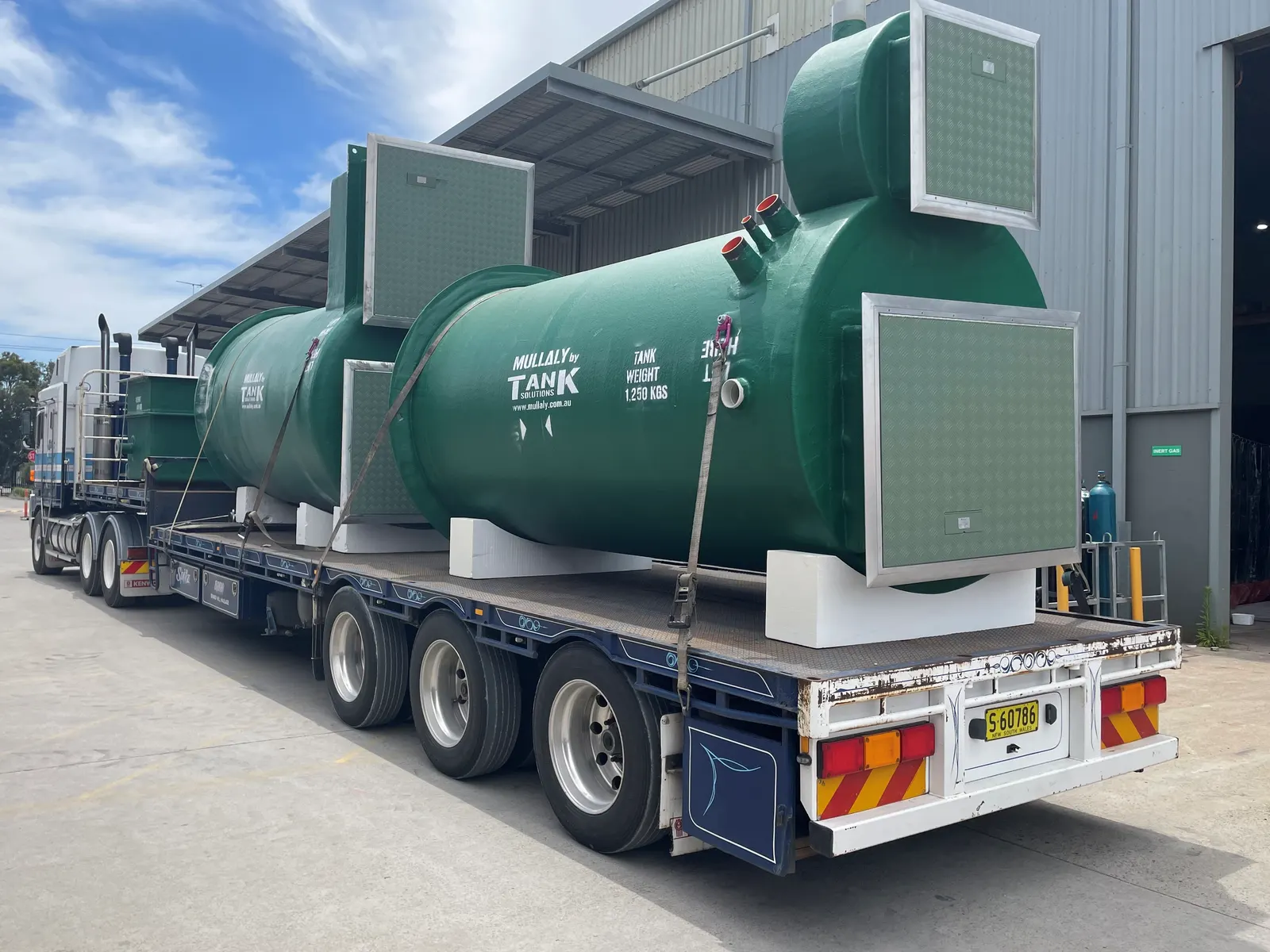 Mullaly FRP pump stations for Ocean Breeze and Rocky Creek strapped to a semi-trailer for delivery