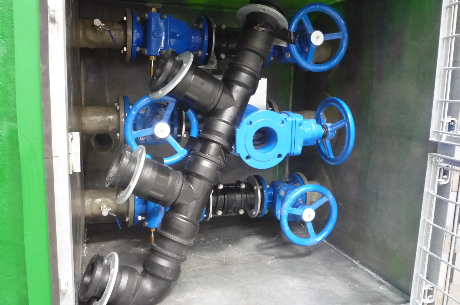 Gate valves and discharge pipework inside the valve chamber of a Mullaly FRP pump station